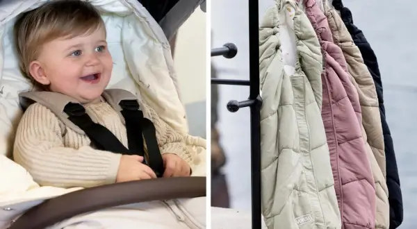 Glad baby i barnvagnen, redo för en härlig barnvagn sommar. Bredvid hänger varma åkpåsar i olika färger.