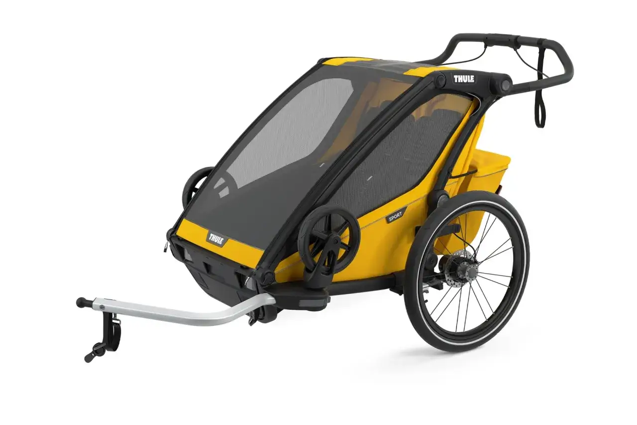 Gul cykelvagn fr&aring;n Thule, en p&aring;litlig Thule baby supporter f&ouml;r &auml;ventyr.